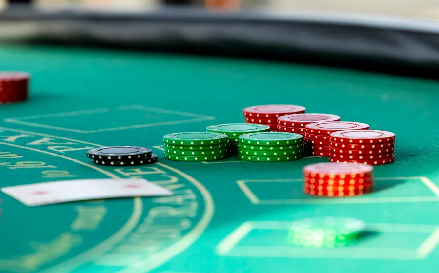 Casino chips on a green table